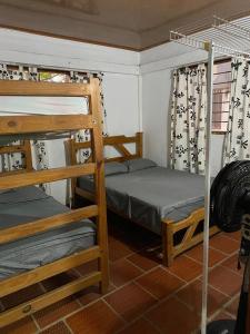 Ένα ή περισσότερα κρεβάτια σε δωμάτιο στο Cabaña Pepa Mar Azul