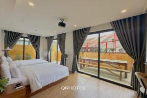 Voodi või voodid majutusasutuse QR Hotel Dalat toas
