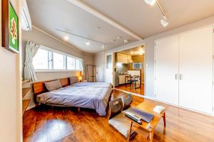 Postel nebo postele na pokoji v ubytování 栄町 ロータリービル