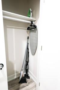 a room with a vacuum cleaner hanging on the wall at Perch in Paradise EaglesThemed Escape in Philadelphia +5 photos