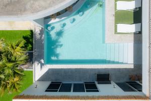 an overhead view of a swimming pool in a house at Prava in Yonaha