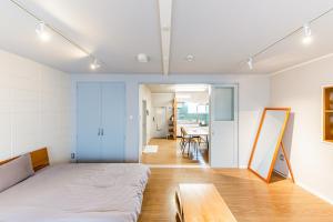 Postel nebo postele na pokoji v ubytování 栄町 ロータリービル