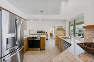 a kitchen with a stainless steel refrigerator at 1692 Marco Island in Marco Island