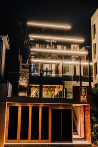 a building with lights on top of it at night at KalaMar Hotel in Viña del Mar