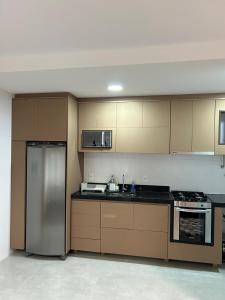 Kuchyň nebo kuchyňský kout v ubytování Ap Novo Moderno Itapua Vila Velha ES