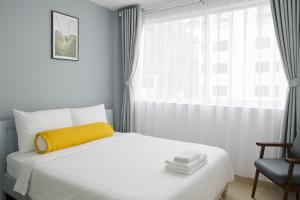 Postel nebo postele na pokoji v ubytování Amory Hotel Saigon Center