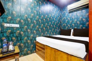 Ένα ή περισσότερα κρεβάτια σε δωμάτιο στο Hotel O A K Residency +38 φωτογραφίες