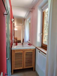 a bathroom with a sink and a mirror at La Bastide en Cévennes in Saint-Hilaire-de-Lavit +55 photos