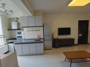 Kuchyň nebo kuchyňský kout v ubytování Capital International Home