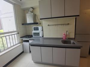 Kuchyň nebo kuchyňský kout v ubytování Capital International Home