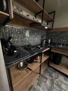 a kitchen with a stove with pots and pans at Solar Deluxe Arequipa in Arequipa +15 photos