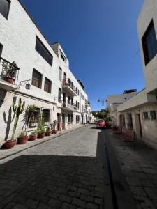 a cobblestone street in an alley with buildings at Solar Deluxe Arequipa in Arequipa