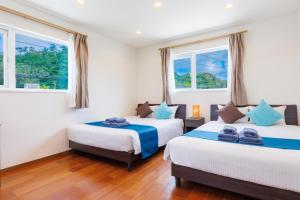 Postel nebo postele na pokoji v ubytování Kahoo House