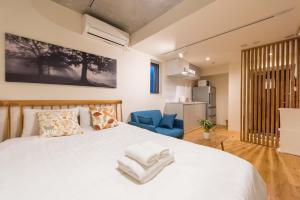 Postel nebo postele na pokoji v ubytování Fare Metallo Tokyo Nakano 11-room Hotel