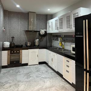 Kuchyň nebo kuchyňský kout v ubytování Nice Villa Resort Hat Yai