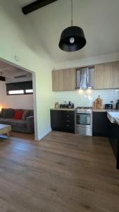 an open kitchen and living room in an apartment at Olinda Church House in Olinda