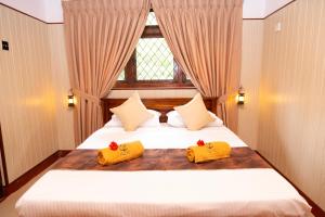 Ένα ή περισσότερα κρεβάτια σε δωμάτιο στο Le Living Nuwara Eliya