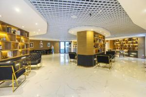 a library with chairs and tables in a building at Artisan Ratchada Spacious 2BR Condos in Bangkok