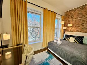 a bedroom with a bed and a window at Hotel-Style, No Host, Professionally Managed ID289 in Jersey City