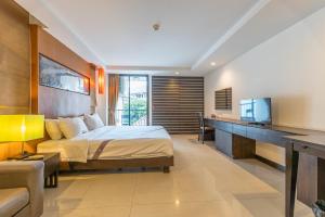 Ένα ή περισσότερα κρεβάτια σε δωμάτιο στο Daheng Hotel Pattaya Walking Street Branch +39 φωτογραφίες