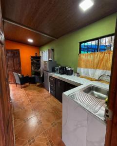 a kitchen with a sink and a counter top at Cabaña Vista al Valle in Paraíso