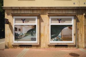 two windows on the side of a building at Bambi Boutique Rooms - Loftové izby 300 m od centra Banskej Bystrice, Self check-in in Banská Bystrica