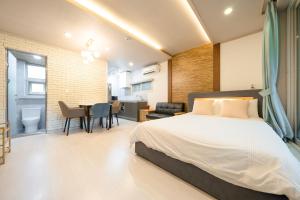 a bedroom with a bed and a dining room at Huerim Pool Villa Private Pension in Gyeongju +5 photos