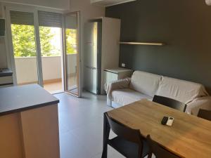 a living room with a couch and a table at Al parco1 in Termoli