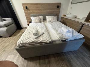 Postel nebo postele na pokoji v ubytování HA-LU Studio Apartman