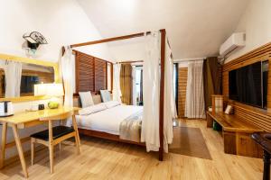Cama o camas de una habitación en 枕窗听雨Homestay