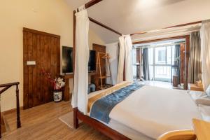 Cama o camas de una habitación en 枕窗听雨Homestay