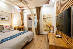 Postel nebo postele na pokoji v ubytování 枕窗听雨Homestay