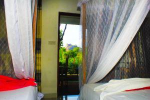 Voodi või voodid majutusasutuse Sigiriya Palace View toas