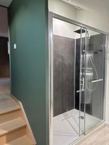 a glass shower stall in a room with a stair at Côté Gîtes Cassel in Cassel +11 photos