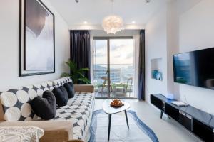 Μια τηλεόραση ή/και κέντρο ψυχαγωγίας στο Condotel The Song Vũng Tàu - Apartment Near The Beach