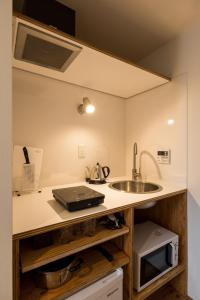 A kitchen or kitchenette at Smi:re Stay Tokyo