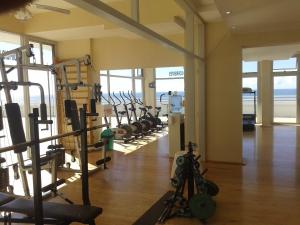 a gym with a bunch of treadmills and machines at Radar Mirador Cabo Corrientes in Mar del Plata