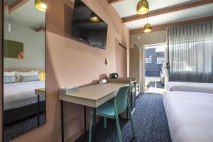 Nightcap at Sandbelt Hotel客房内的一张或多张床位