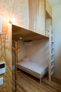 A bunk bed or bunk beds in a room at Smi:re Stay Tokyo