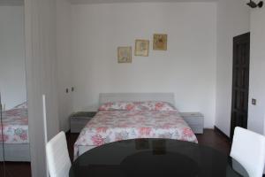 En eller flere senge i et værelse på Alla Villa