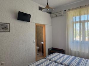 Pythaïs Hotel客房内的一张或多张床位
