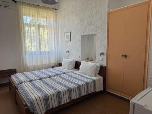 Pythaïs Hotel客房内的一张或多张床位