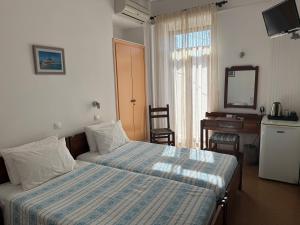 Pythaïs Hotel客房内的一张或多张床位