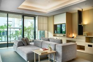 a living room with a couch and a table at ふふ東京銀座 in Tokyo +8 photos