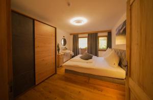 Postel nebo postele na pokoji v ubytování Apartments Wiglhof