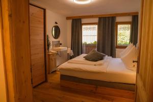 Postel nebo postele na pokoji v ubytování Apartments Wiglhof
