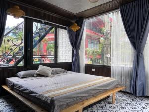 Postel nebo postele na pokoji v ubytování Vạc Villa - Tam Đảo + 43 fotografií