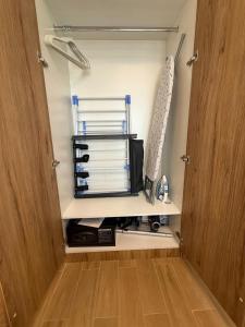 a room with an open door with a closet at Stylish Jr 1BR on Maryah Island near Cleveland by Central Stay in Abu Dhabi