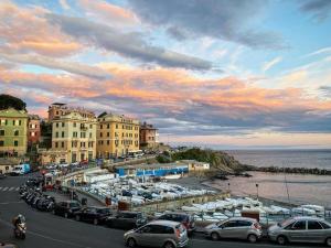 a group of cars parked next to a marina with boats at Apt Bilocale Mare&Gaslini Wi-Fi Veloce in Genova