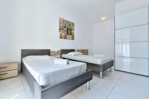 Ένα ή περισσότερα κρεβάτια σε δωμάτιο στο Central Paceville Apartment